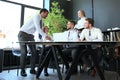 Businessman shaking hands to seal a deal with his partner and colleagues in office Royalty Free Stock Photo