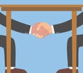 Businessman shaking hands under the table