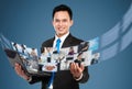 Businessman sharing his photo and video files using laptop Royalty Free Stock Photo