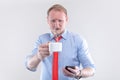 Businessman in a shirt with a red tie with cup of coffee ready for action. Bussines model poster concept Royalty Free Stock Photo