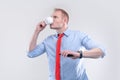 Businessman in a shirt with a red tie with cup of coffee ready for action. Bussines model poster concept Royalty Free Stock Photo