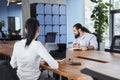 Businessman in shirt is sitting at table and taking some notes Royalty Free Stock Photo