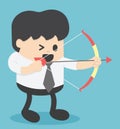 Businessman shooting archery