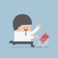 Businessman and shopping cart with black friday sale label