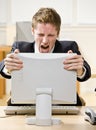 Businessman shouting at computer Royalty Free Stock Photo