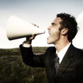 Businessman Shouting Megaphone Field Concept