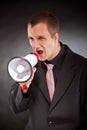 Businessman shouting through megaphone Royalty Free Stock Photo