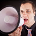 Businessman shouting through megaphone Royalty Free Stock Photo