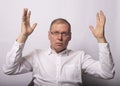 Businessman show smth with both hands in surprise and shock Royalty Free Stock Photo