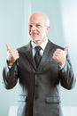 Businessman showing double thumb up