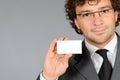 Businessman showing emty business card