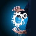 Businessman showing gears cogs to success concept Royalty Free Stock Photo