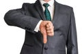 Businessman showing gesture with thumb down