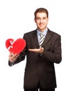 Businessman showing a heart-shaped gift