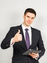 Businessman showing OK sign with his thumb up. Royalty Free Stock Photo