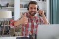 Businessman showing OK sign with his thumb up. Selective focus on face Royalty Free Stock Photo