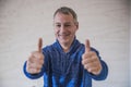 Businessman showing OK sign with his thumb up. Selective focus. Royalty Free Stock Photo