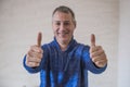 Businessman showing OK sign with his thumb up. Selective focus. Royalty Free Stock Photo