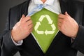 Businessman Showing Recycled Symbol Under His Shirt