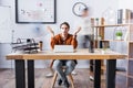 Businessman showing shrug gesture while sitting Royalty Free Stock Photo