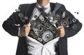 Businessman showing a superhero suit underneath machinery Royalty Free Stock Photo