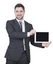 Businessman showing tablet