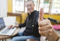 Businessman showing thumbs up to camera Royalty Free Stock Photo