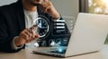 Businessman interacting with virtual screen managing tasks and time using technology solutions Royalty Free Stock Photo