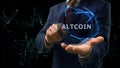 Businessman shows concept hologram Altcoin on his hand