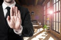 Businessman shows stop gesture with his hand in industrial style loft, 3D Illustration