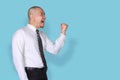 Businessman Shows Winning Gesture, Side View Profile Royalty Free Stock Photo