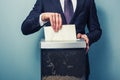 Businessman shredding documents