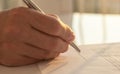 Businessman is signing a contract, close up of male hand putting signature Royalty Free Stock Photo