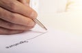 Businessman is signing a contract, close up of male hand putting signature Royalty Free Stock Photo