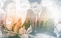 Businessman signing contract while his partner is looking at him Royalty Free Stock Photo