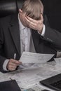 Businessman signing a contract. The Manager makes the report and fills in the Declaration. Businessman at work in his workplace.