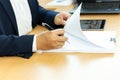 Businessman signing contract paper with pen in office desk. Royalty Free Stock Photo