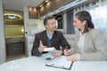 Businessman signing contract while partner looking at him Royalty Free Stock Photo