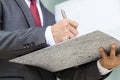 Businessman signing a document