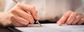 Businessman signing financial contract and hand holding pen putting signature after reaching an agreement. Royalty Free Stock Photo