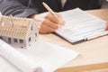 Businessman signing a mortgage Royalty Free Stock Photo