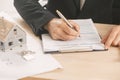 Businessman signing a mortgage contract Royalty Free Stock Photo