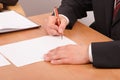 Businessman signing papers - 2 Royalty Free Stock Photo