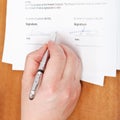 Businessman signs an agreement by silver pen Royalty Free Stock Photo