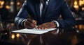 Businessman signs contract, sealing significant transaction or agreement