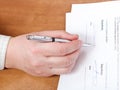 Businessman signs a contract by silver pen Royalty Free Stock Photo