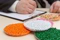 The businessman signs a contract for the supply of plastic granules for the industry. Plastic raw materials in granules . Polymer Royalty Free Stock Photo