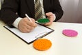 Businessman signs a contract for the supply of plastic granules for industry. Plastic raw material in granules . Polymer, plastic Royalty Free Stock Photo