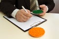 Businessman signs a contract for the supply of plastic granules Royalty Free Stock Photo