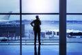 Businessman silhouette calling in airport lobby